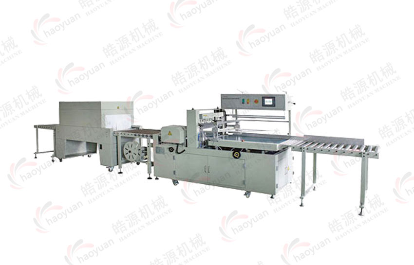 GB-600Full automatic heat shrinkable packaging machine with edging, sealing and cutting (fully enclosed)